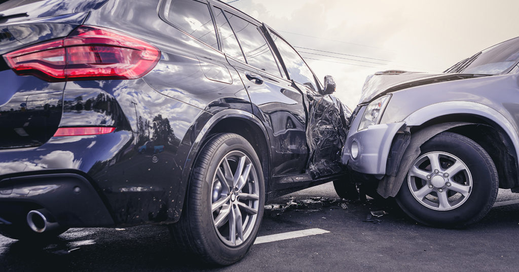 A car crash depicting two SUVs involved.